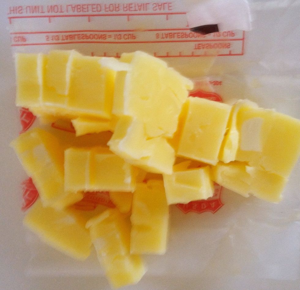 3/4 stick (6 tablespoons) cold butter cut into cubes. Add to food processor and pulse a few times. Do not keep the processor running.
