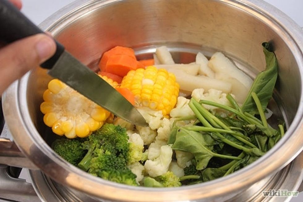 3. After a minute and a half, prick all the vegetables with a knife to test them. The green ones should be closer to done than the others. If they seem ready, the steaming is done!