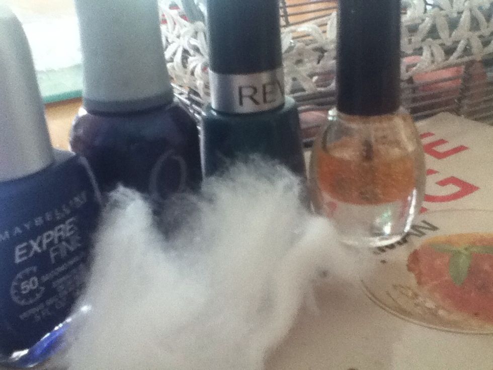 3 dark nail polishes . I have chosen a metalic blue , green and purple. You will also need cotton wool and a glitter nail polish..
