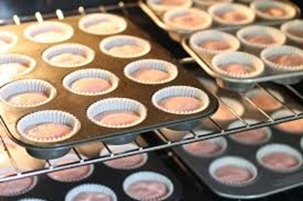 3. Divide the cake mixture evenly between the paper cases and bake for 20 mins until firm to the touch. Remove from the tins and allow to cool on a rack.
