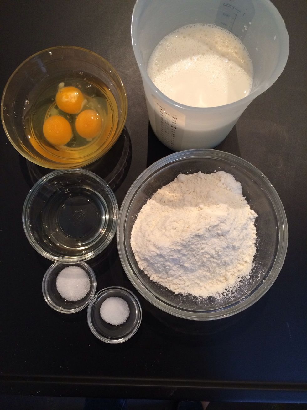 3 eggs, milk and water, flour, salt and sugar and the oil....or melted butter if u prefer