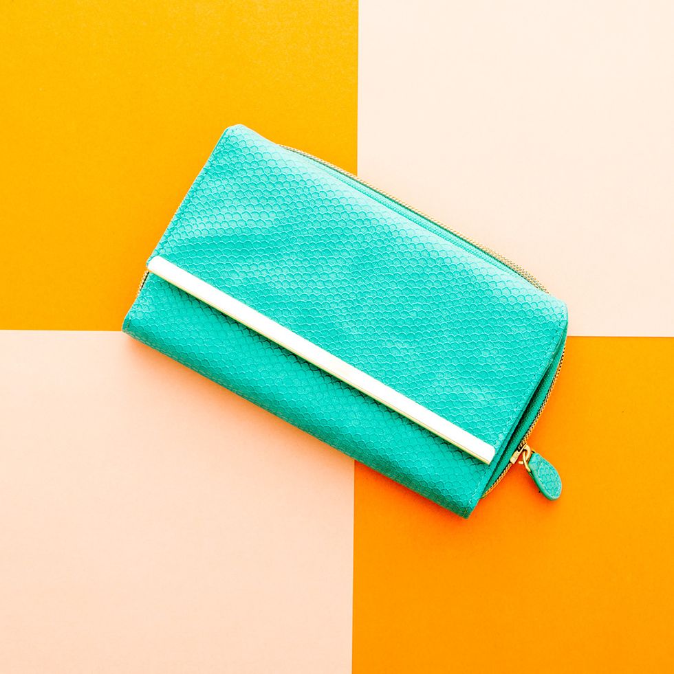 3. Faux Reptile Embossed Wallet ($24.99): This electric pop of color will liven up your purse game, and it\u2019s even large enough to carry as a small clutch.