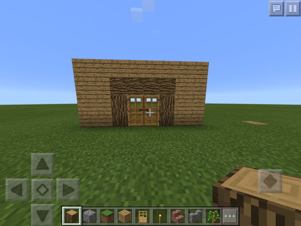 3. Go to the last place where you have placed \u00a0out the block and go up by 3 blocks again which would look like a wall with a gap. Fill in the gap with oak wood Planks after that place to doors at the