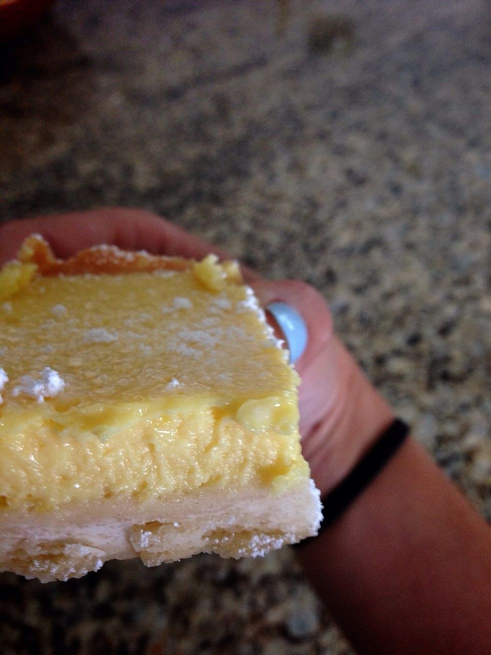 ....3 hours later...lemon bars got cut into individual pieces with an addition of a bit of powdered sugar on top....drool