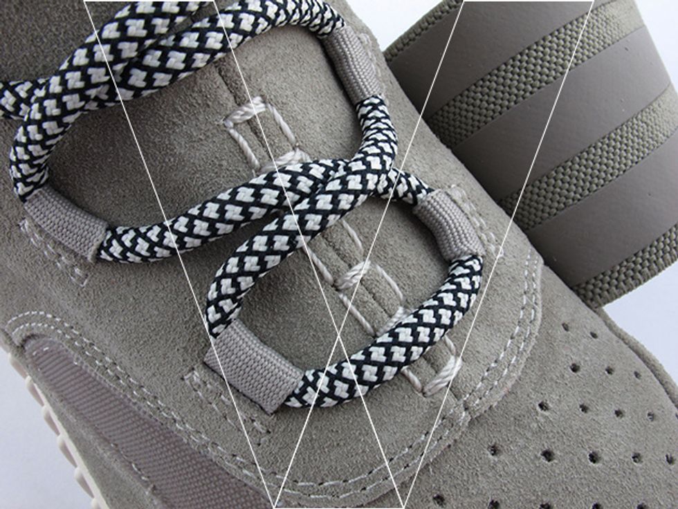 3. Lace Stitching: Check that the stitch line below each lace loop is tight, neat and evenly spaced. Make sure the double stitch line follows the edge of the suede panel perfectly.