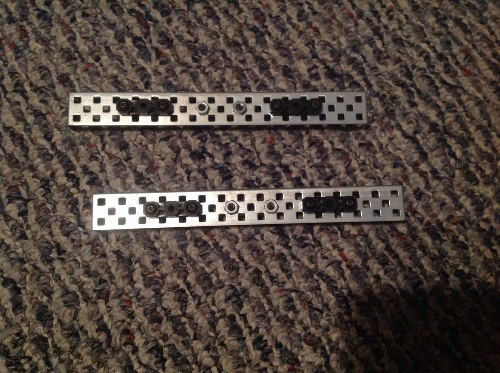 3. Next, attach 4 Offset Pieces to the outside of both Rails in the same place and method as you did in Step One.