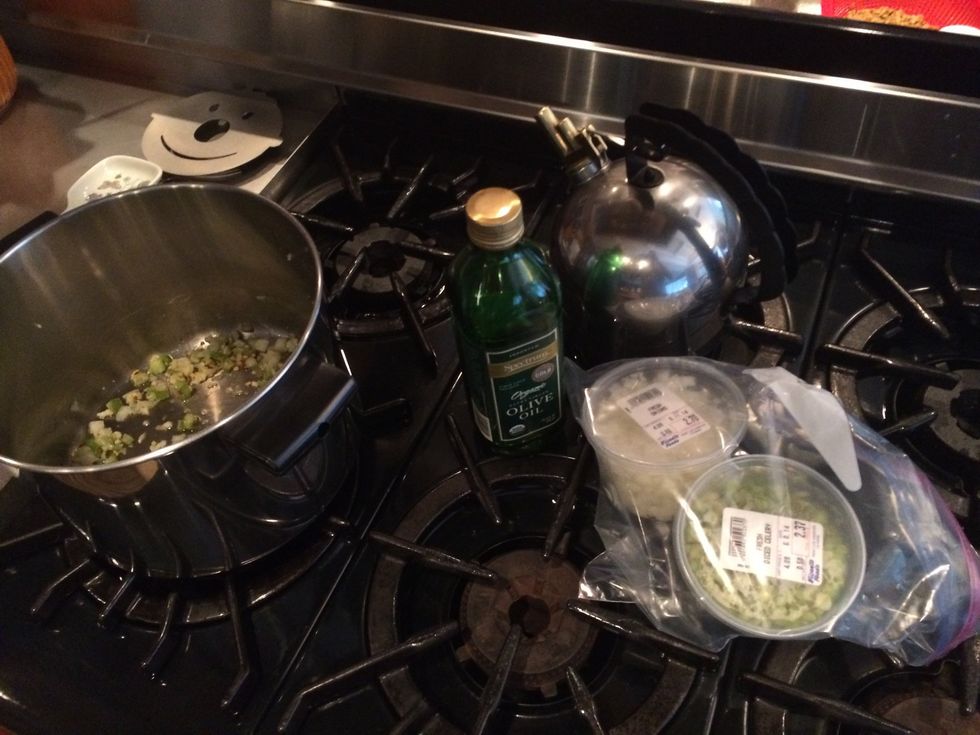 3 or 4 pinches of chopped onion and celery (each), 5xgarlic cloves, 5xred pepper flakes, 3 or 4 caps of olive oil Turn on stove on low until you smell ingredients coming together and stir