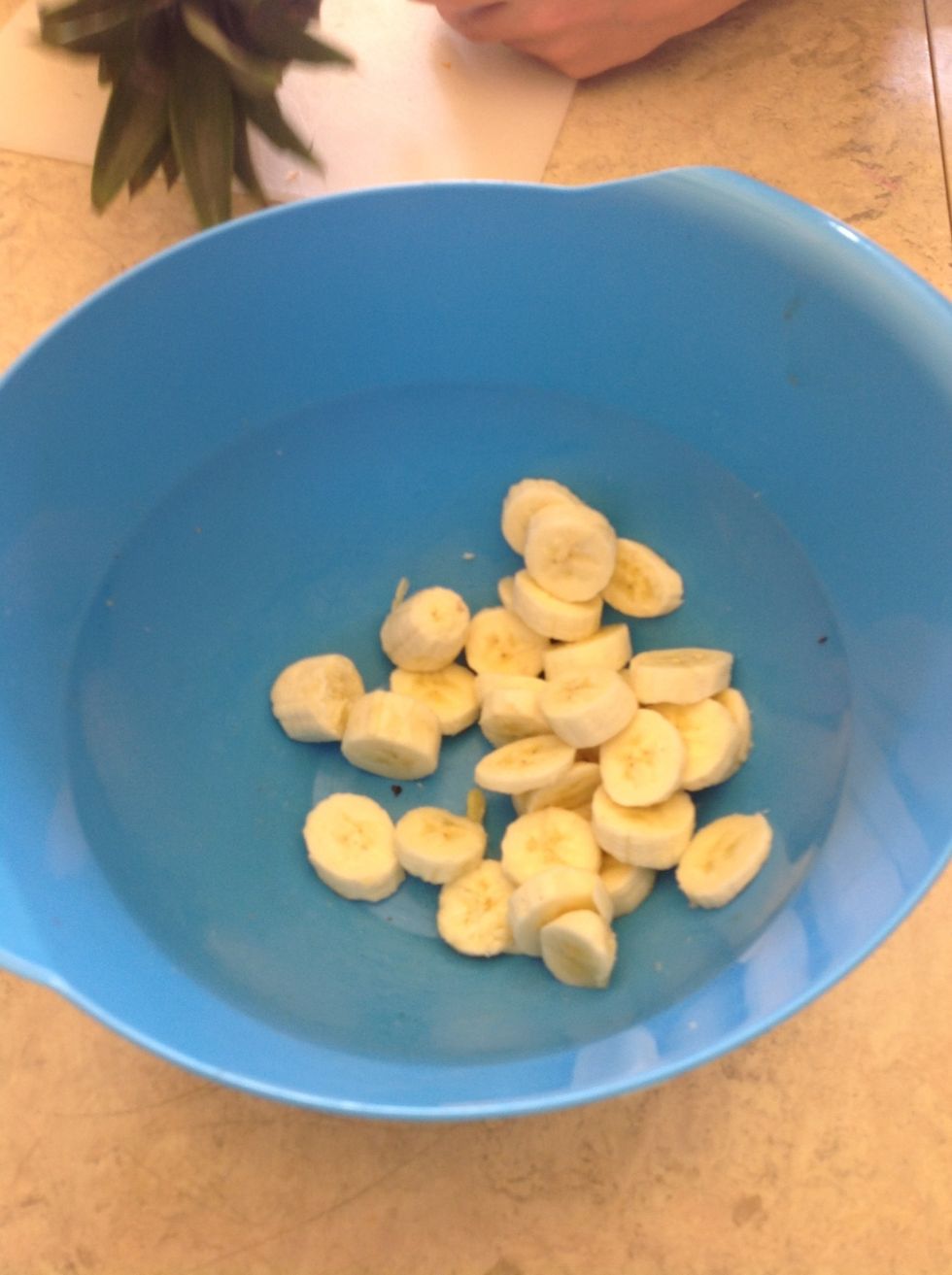 3. Put the bananas into the bowl.