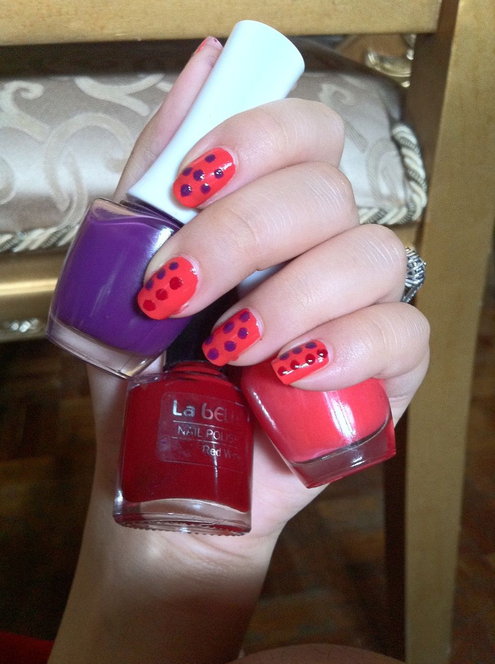 3: Thesw are the colours i use to make the nail. The orange one for the base, the purple one for the side dots and the red one for the middle dots.