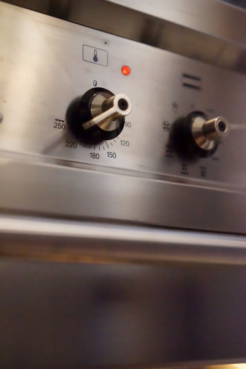 30 minutes before the dough is ready to be baked, pre-heat oven to 230 degrees Celsius (450 degrees Fahrenheit).