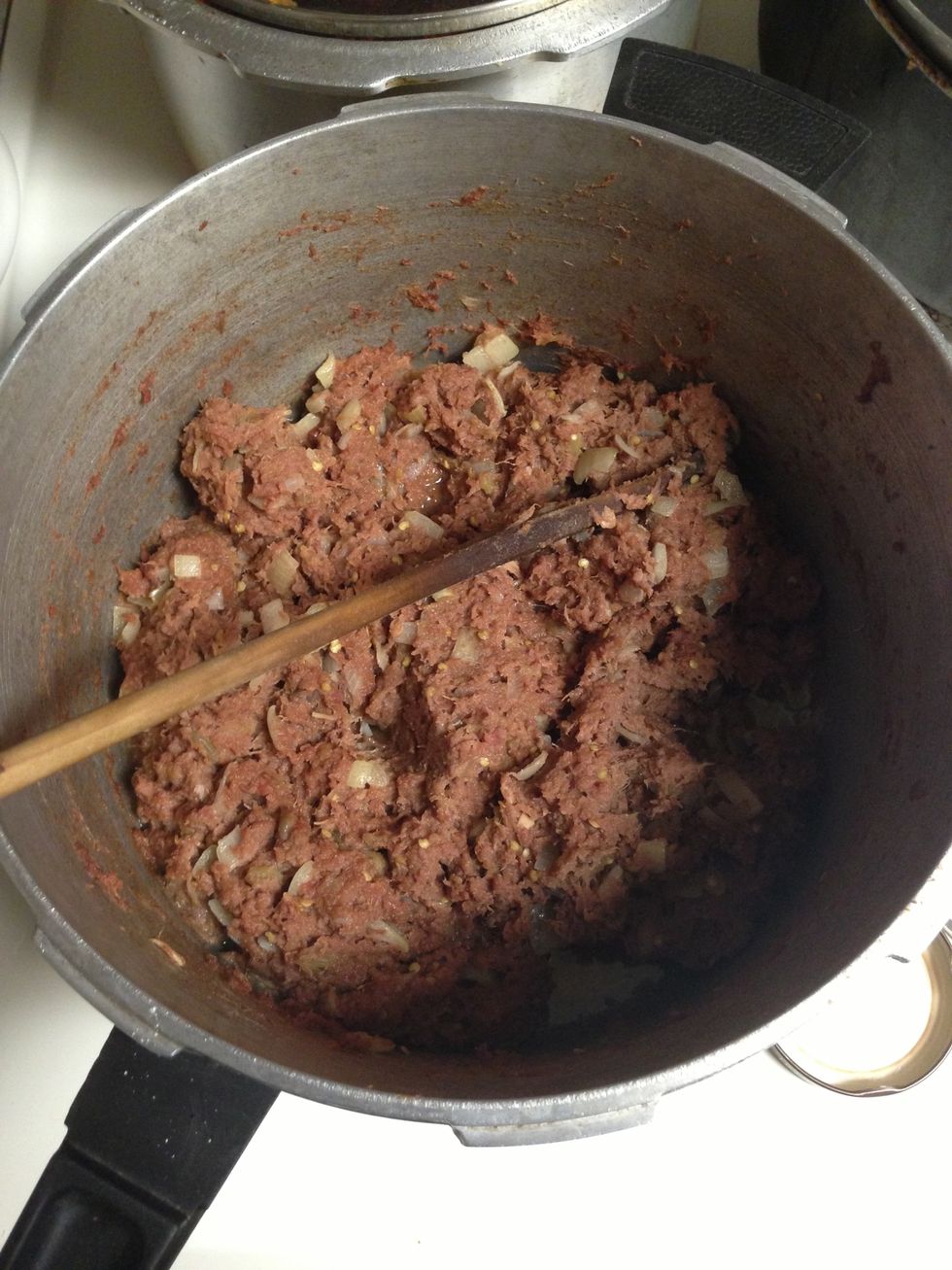 3cans of corned beef steamed on a stove and stirred for 10mins and then added with chopped onions and stirred for 3mins and then added with cooked/drained eggplant stirred for 5-10mins and was done