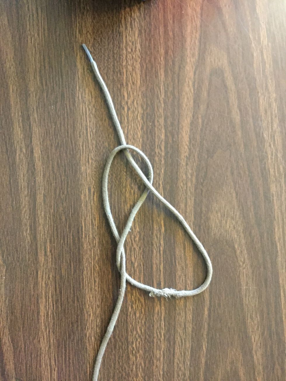 3rd Pull the right side through the loop