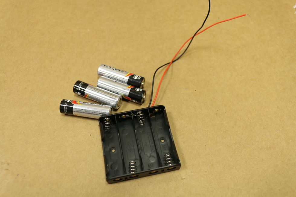 4 AA Batteries and a battery holder.