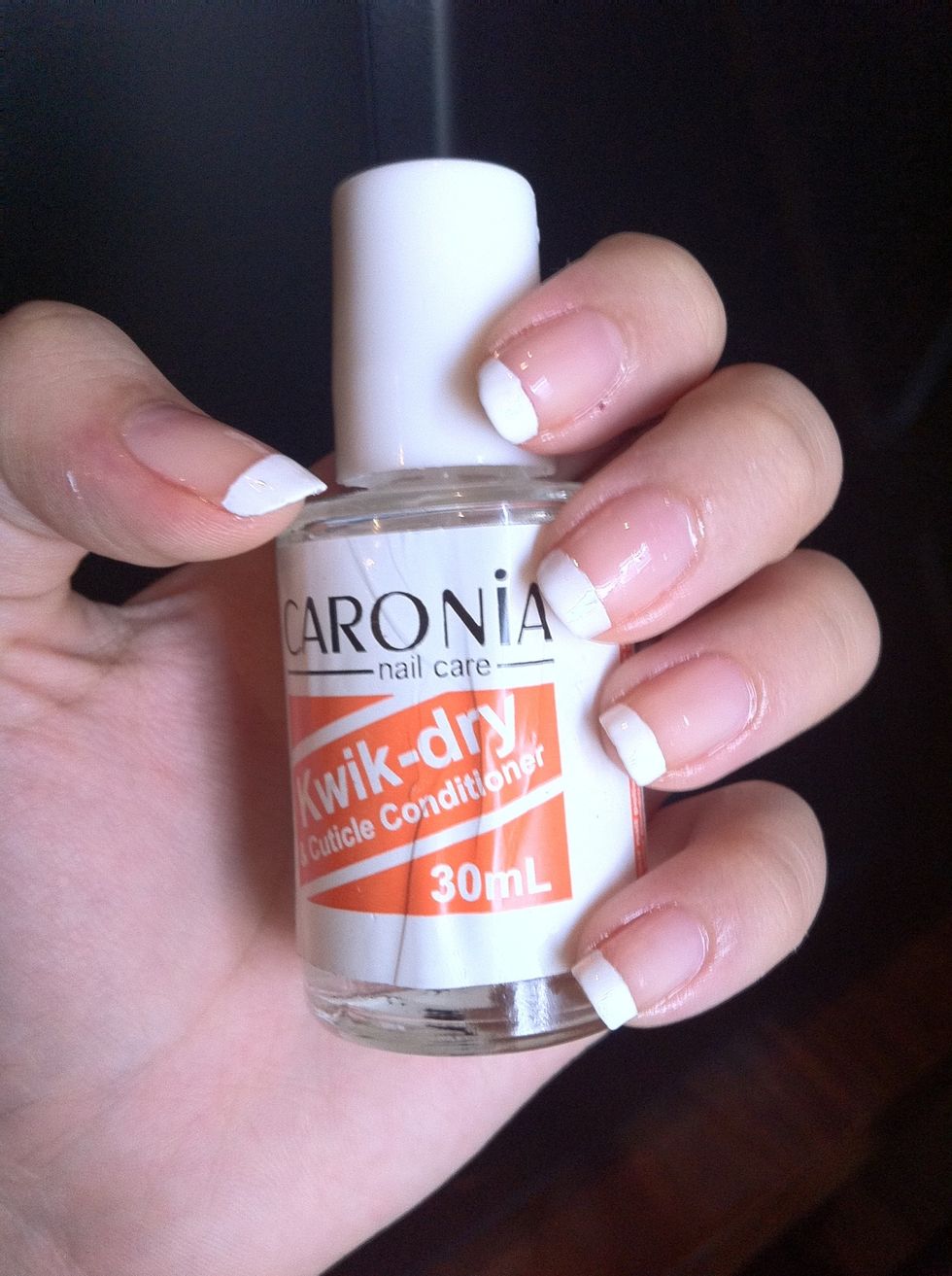 4: After 30sec/1min put on this quick dry. This step is optional, you better use if you have one coz it will orevent your nail polih from getting spoiled till its really2 dry.