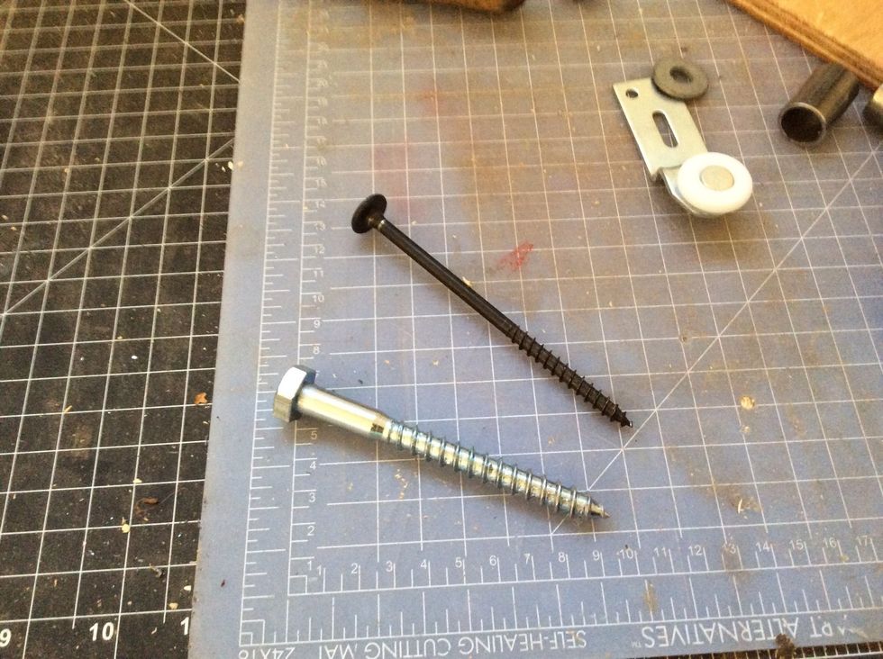 4 inch bolt with large top should be used for the end of each of the track. The thinner screw with a flush head should be used throughout the middle, evenly spaced. Attach to studs.