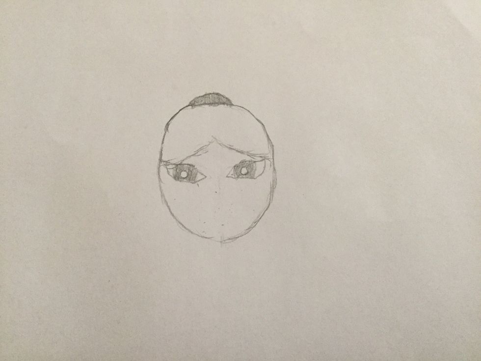 4. Next draw a circle inside the eye line as a eyeball then draw a little circle inside the eyeball then colour it in but not the little circle