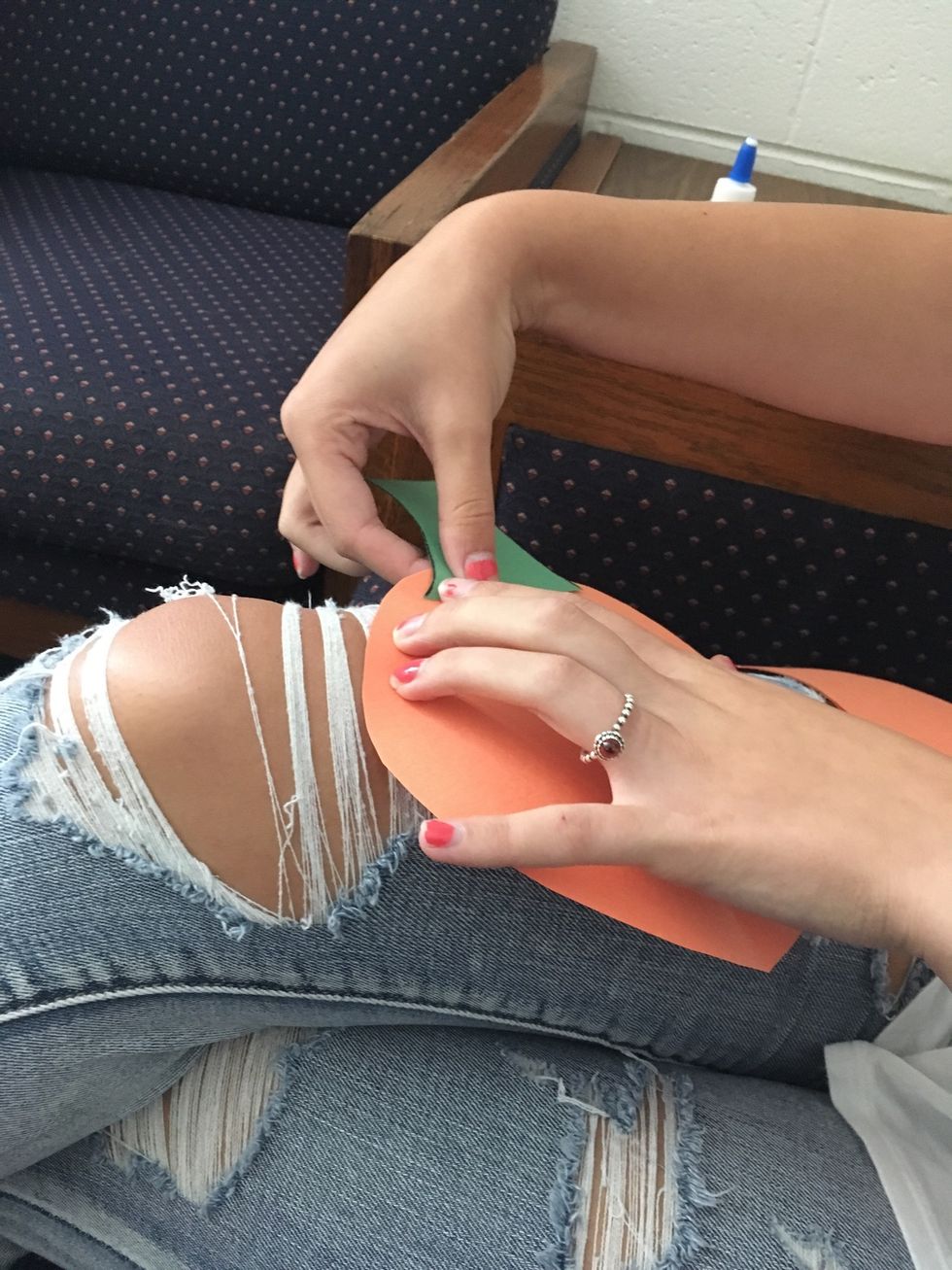 4. Next, hold the stem onto the pumpkin to dry it.