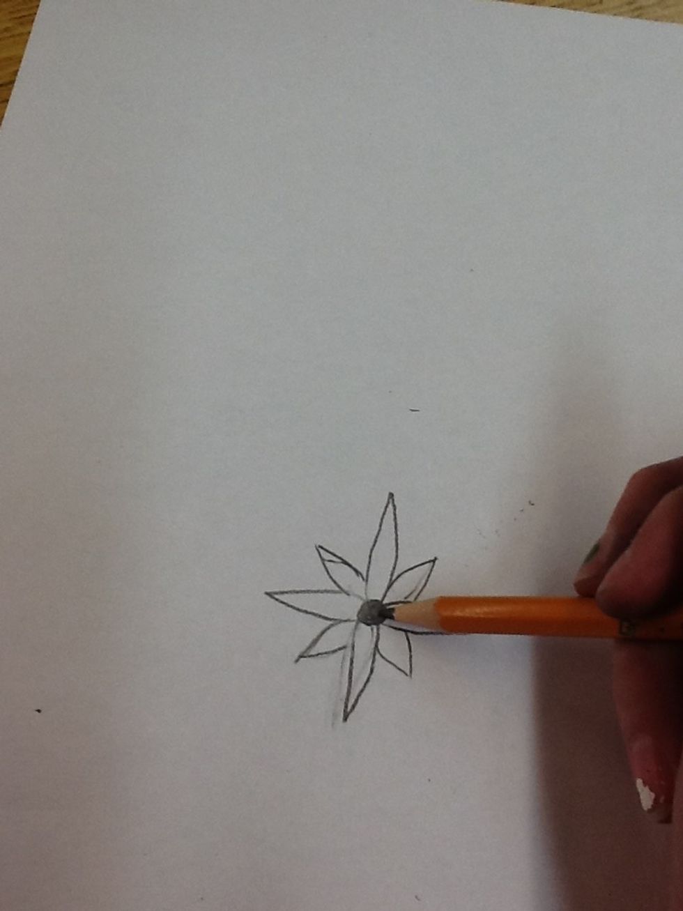 4) Now, you're going to draw a small circle in the middle of your flower petals.