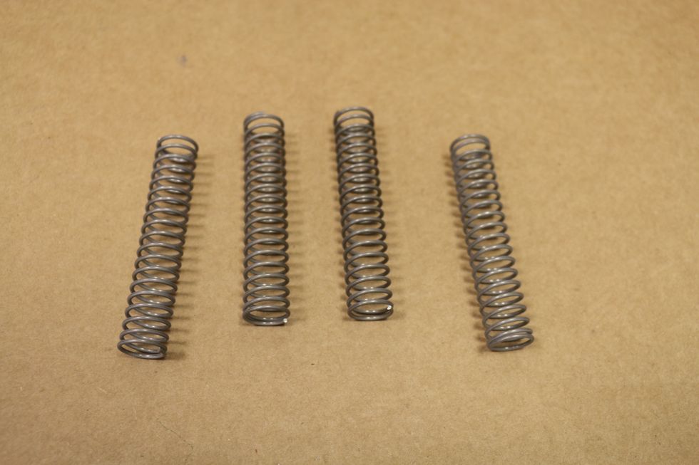 4 of the 3" long springs. You want ones that are flexible enough that allow you to shake the plate form back and forth but strong enough to hold the weight of what you put on it. http://goo.gl/ql4JE9