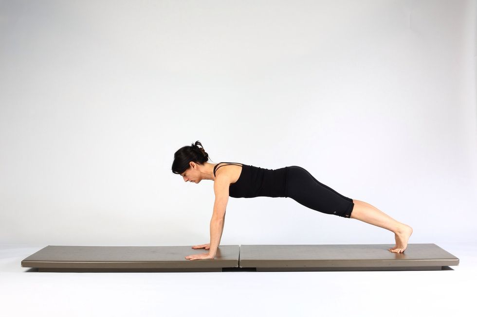 4. PLANK WALK OUTS-  Extend left knee and hip  so left leg is straight.  Both legs are now long.  Make sure your torso, hips shoulders and arms remain still and level.