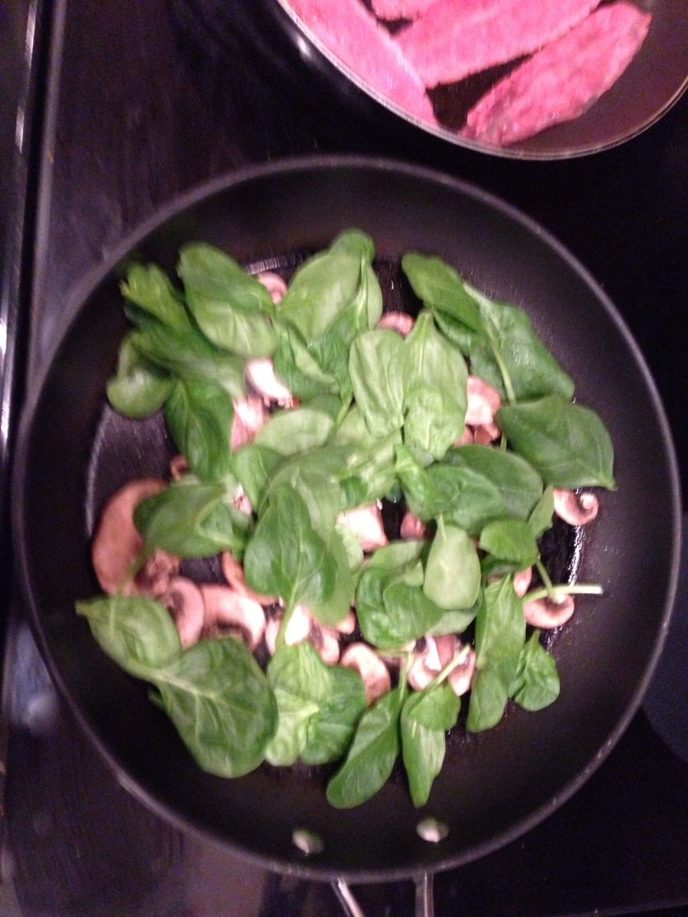 4. Saut\u00e9 your mushrooms, bell peppers (not pictured) and some of the spinach leaves in a few sprays of olive oil. This will give it a nice combination of crunchy to soft textures.
