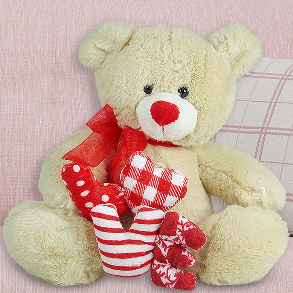 4. Soft Toys: Soft toys like teddy bears are hugely popular among women, especially if she is childlike. Gift her baby pink teddy bear and watch her redden.
