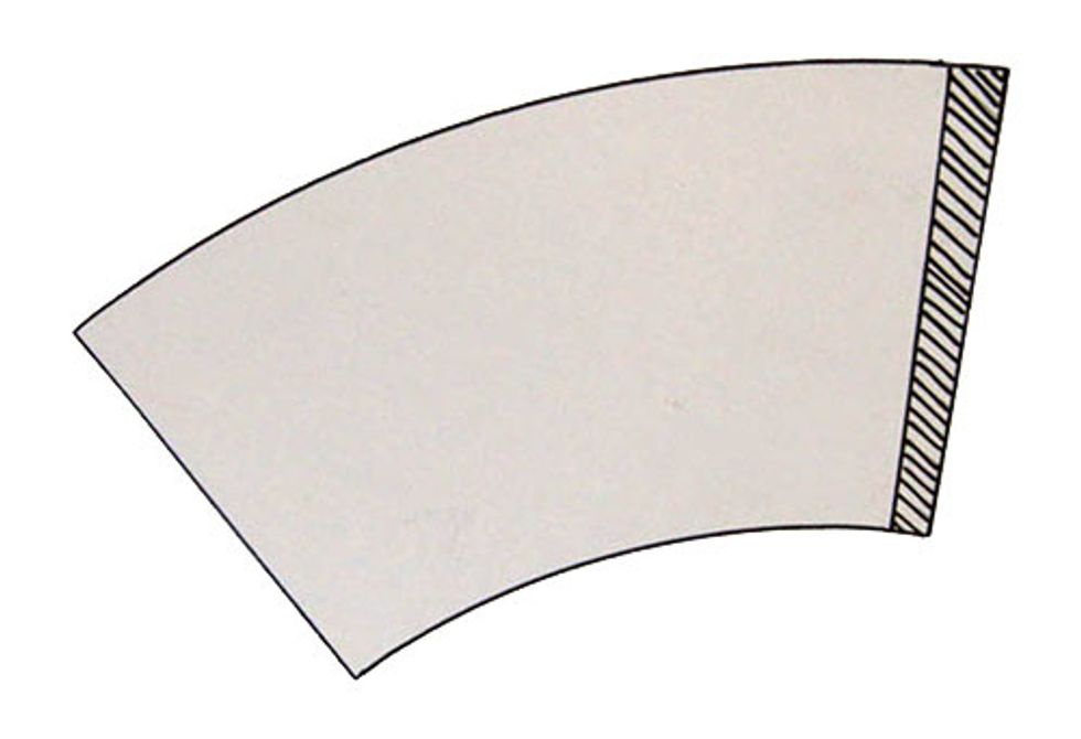 4.\tTrace your template onto the back of your decorative paper.  Add approximately a 1/2" to the width of your template to ensure your ends overlap. (Shaded area in photo.)