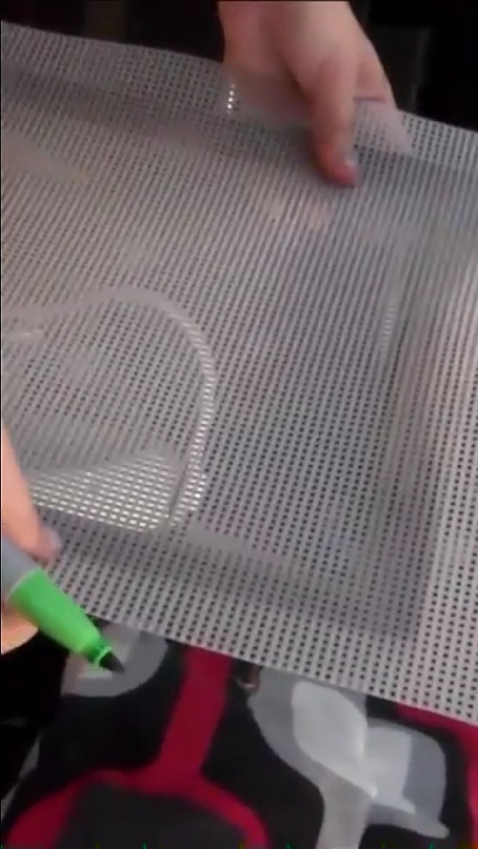 4) you then want to take a marker and trace the back of the frame because the plastic mesh might be too big. Proceed to cut it out leaving about half an inch between the line traced and mesh being cut