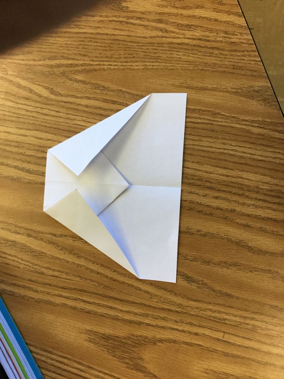 5. Fold top corners so that the edges touch in the middle