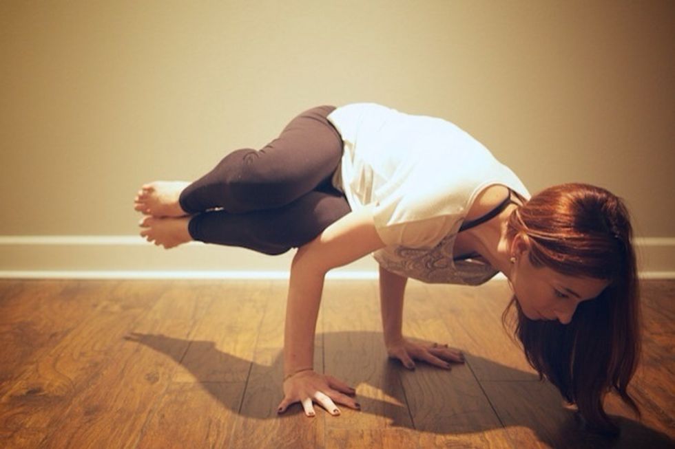 5. Lift off!! Slowly shift your weight forward while keeping the right leg stacked on top of the left. Feet are flexed and legs are glued together. If wrists hurt, come back down.