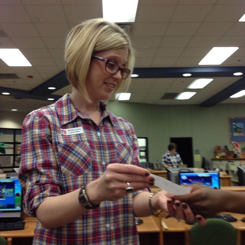 5. Once you have written down your title, you find the librarian and you ask him or her to help you locate the book.