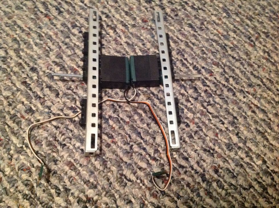 5. Slide another Offset Piece over both Square Bars on the outside. Refer to the picture for where to place it. Then, secure to the body with four, 6-32 1/2" Screws (2 on each side).