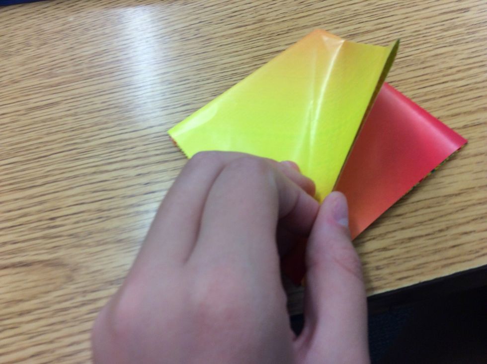 5. Take the right side, as shown, and fold it to the middle. The result should look like the next picture