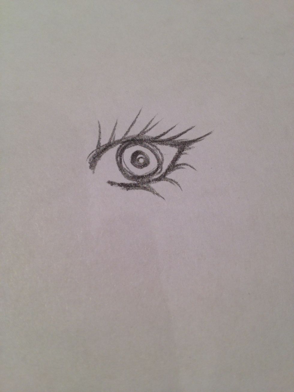 6. Add the pupil. To draw the circle, just go over it a few times- shade it in for a kind of soulless look. Also, for a cat eye, try making the pupil a slit.