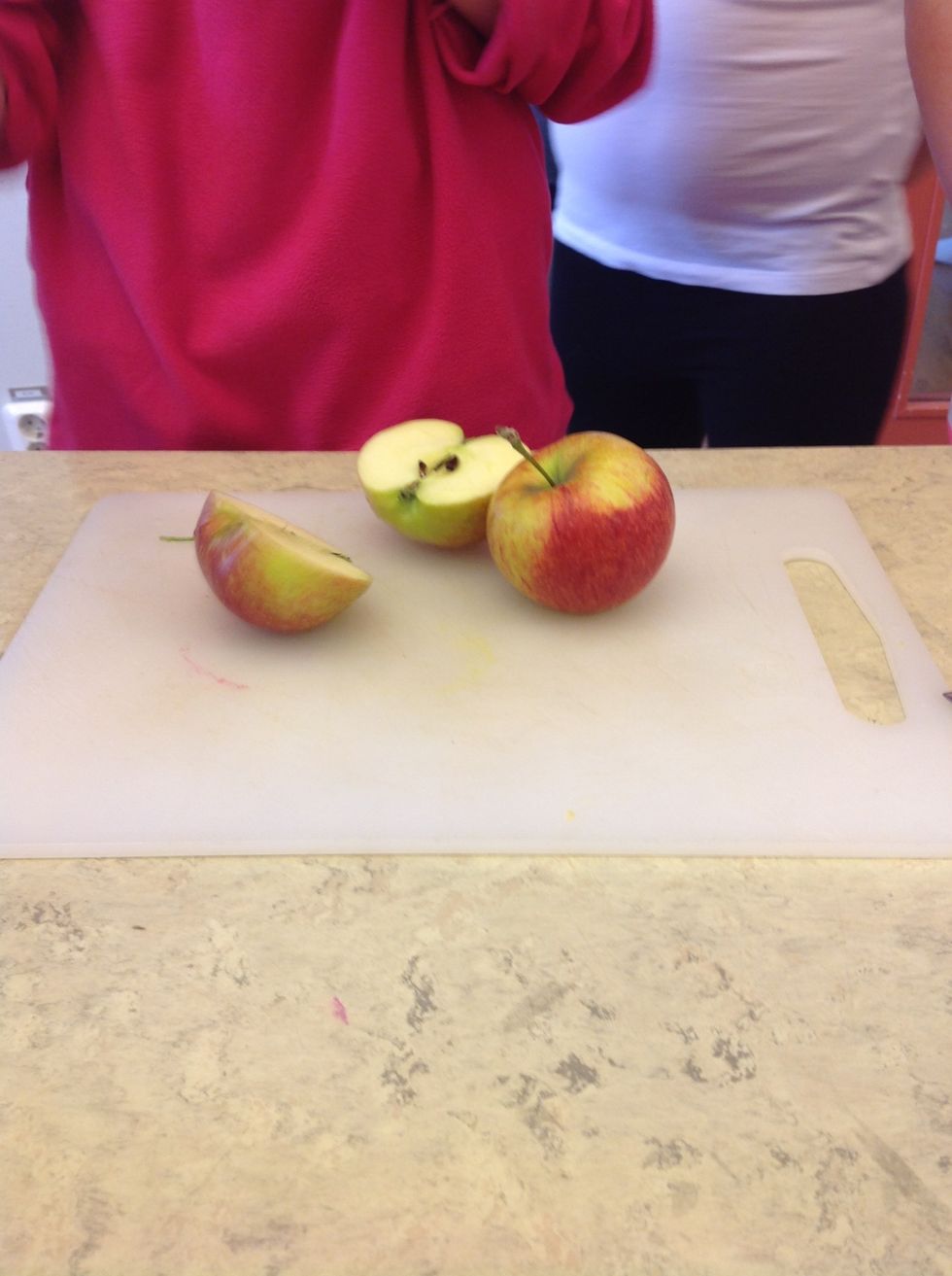 6. Cut the apples in halves.