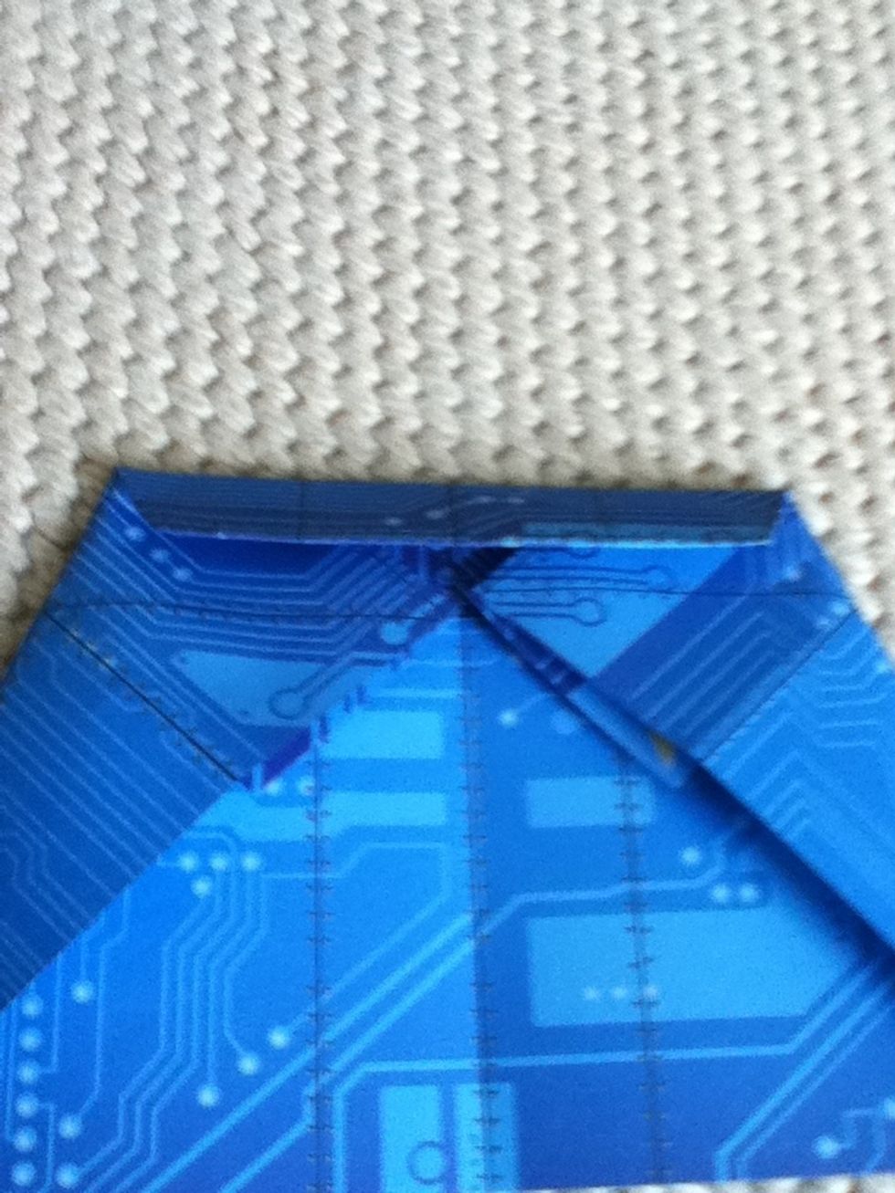 6: fold down the top to where the corners meet.