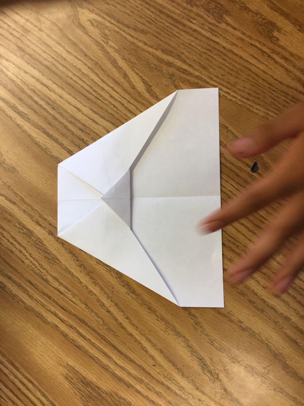 6. Fold the middle tip up to lock the edges in the middle