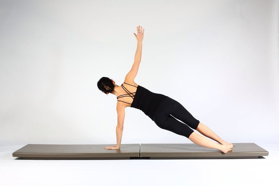6. HIGH PLANK WITH PUSH UP INTO SIDE PLANK Extend elbows and while pushing up lift right hand off floor rotating torso, legs and hips to face left.  Maintain neutral spine throughout