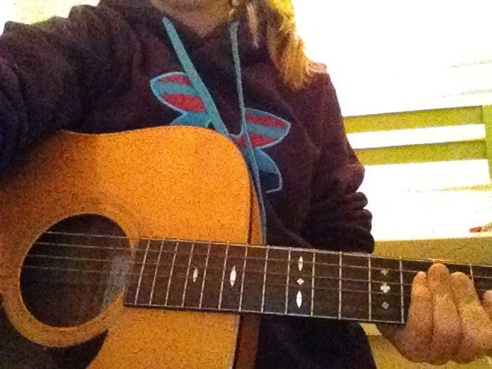 6.) Hold your guitar with the fret board going to the left and the lowest e string closet to you.