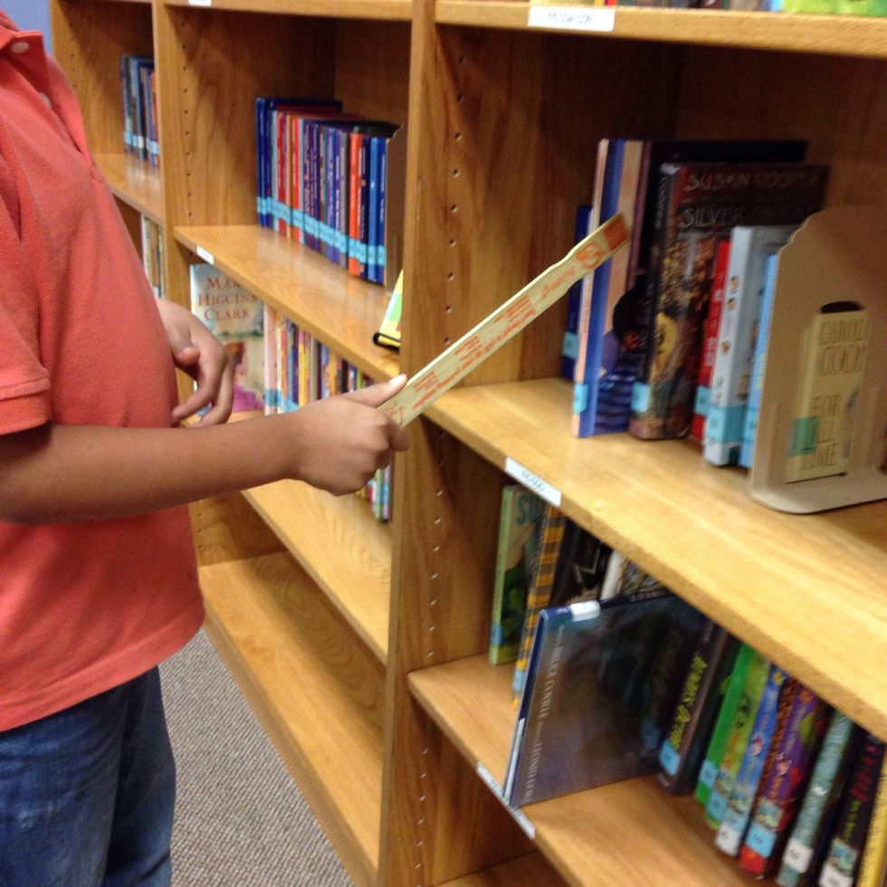 6. If you are browsing independently, you will need to place your shelf marker next to the book that you want to look at.