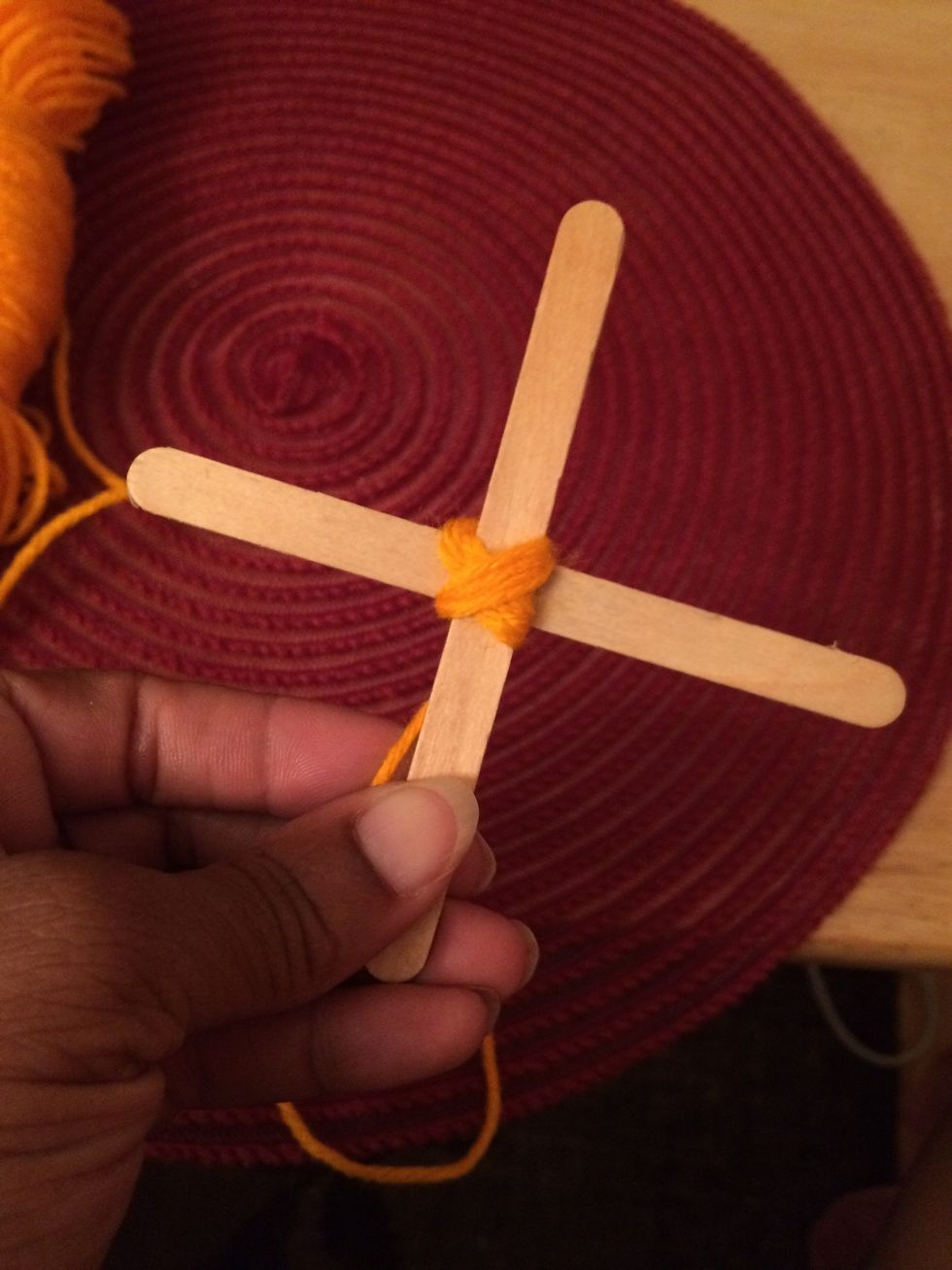 6. Make sure to wrap the yarn around tightly so that the sticks will not loosen.