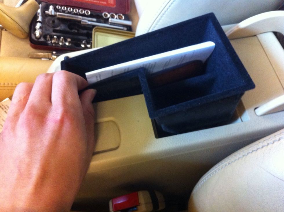 6. Now lift up the what I like to call "st(ash)tray", located under the armrest. Should come out pretty easily. If not - us a small flat screwdriver to carefully pry it open.