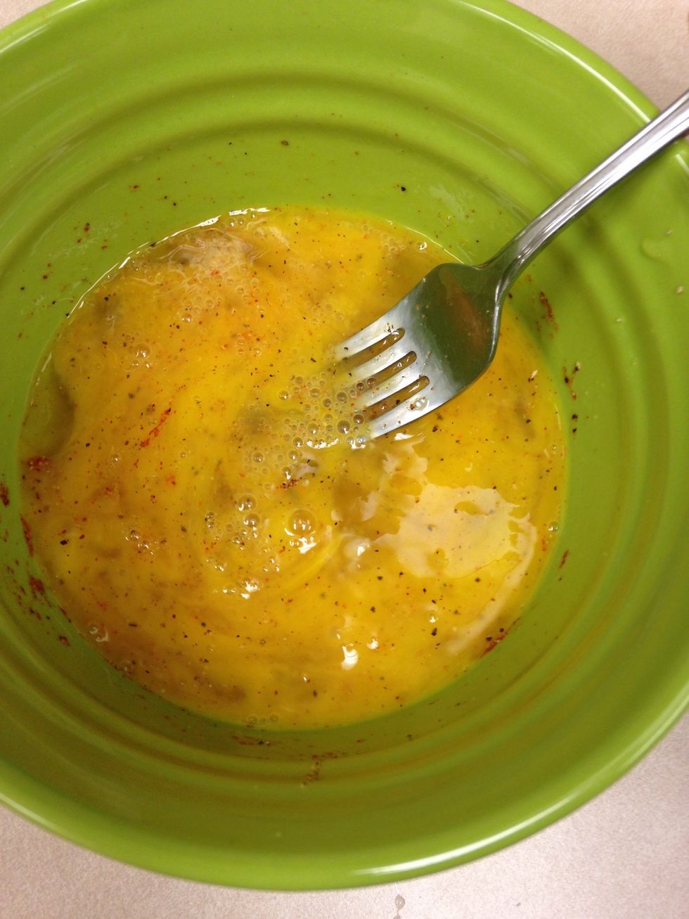 6). Stir eggs and seasoning together breaking the yolk