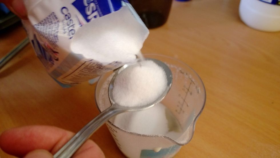 6 tablespoons of fine caster sugar. Some experts say to use fine or icing sugar but I'm not an expert so just use caster sugar. It's all going to melt once cooked. Just my theory lol.