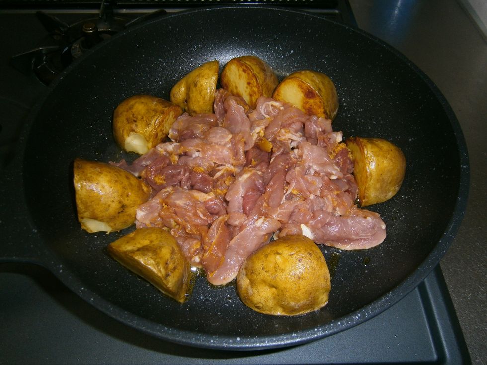 6.\tAfter another five minutes, move the potatoes to the edge of the pan, place the meat in the centre, turn the heat up a little (medium to high), and brown it lightly on both sides.