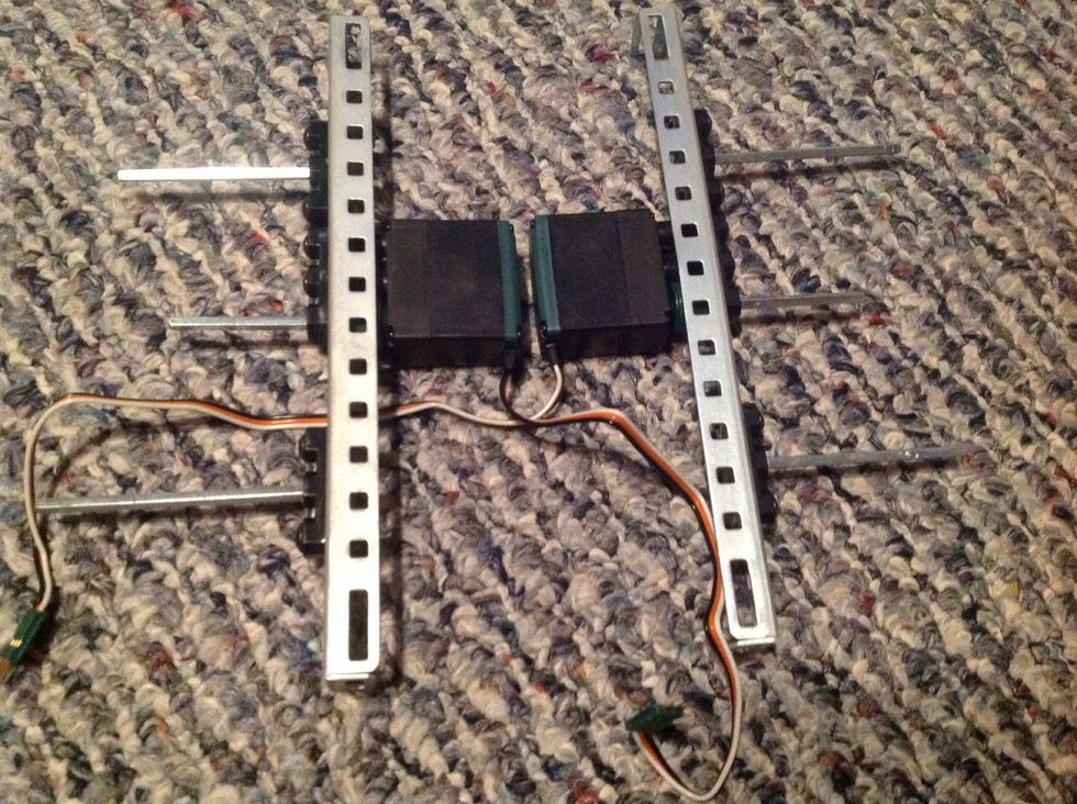 6. Take four 3" Square Bars and slide through each unoccupied Offset Piece on both Chassis Rails. Slide through leaving only a little bit on the inside.
