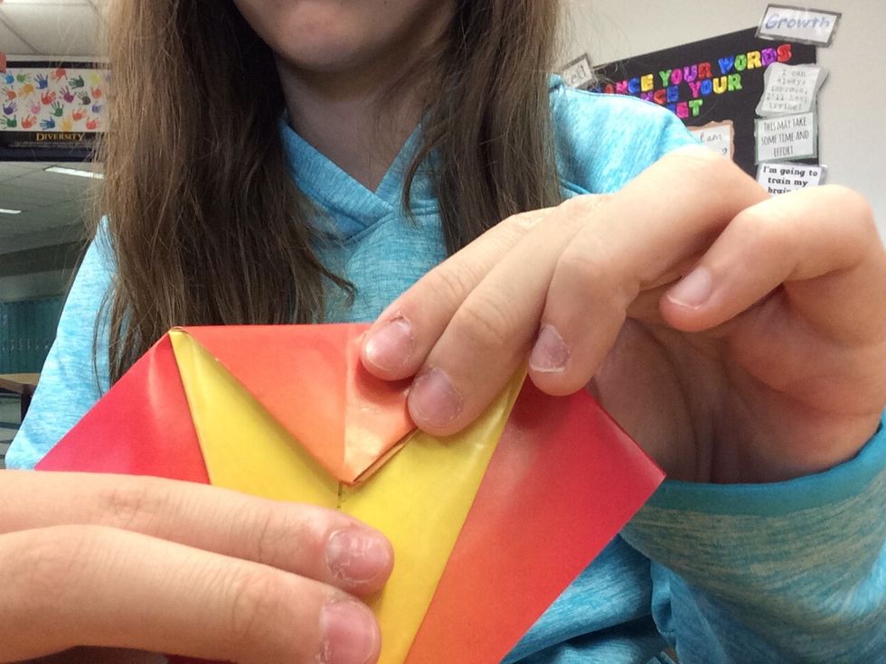 6. Take the triangle at the top, and fold it down.