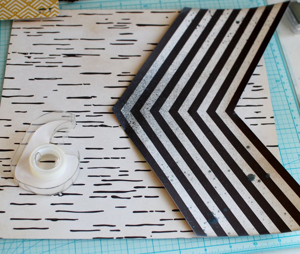 6.\tOnce it is dry, place on the layout sheet. With double sided tape, secure it. You will have parts of the arrows hanging off the layout, so cut off the excess with the ruler and knife.