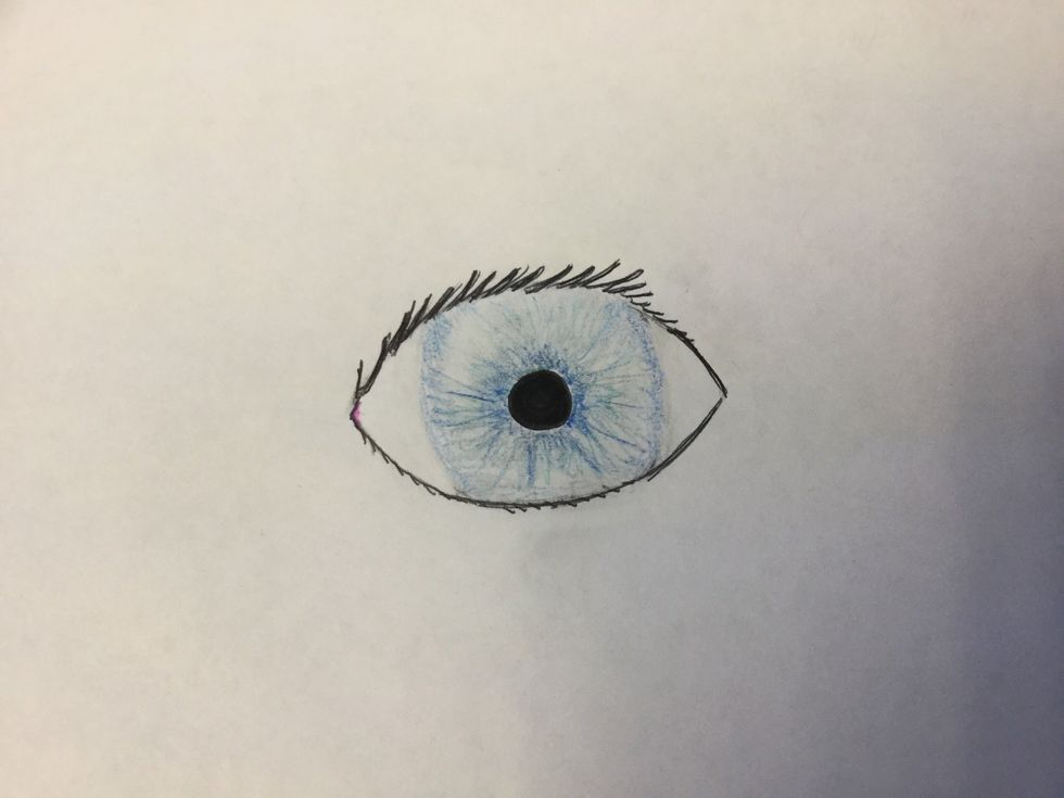 7. Erase a small arc shape near the edge of the iris to make a glare from the light source