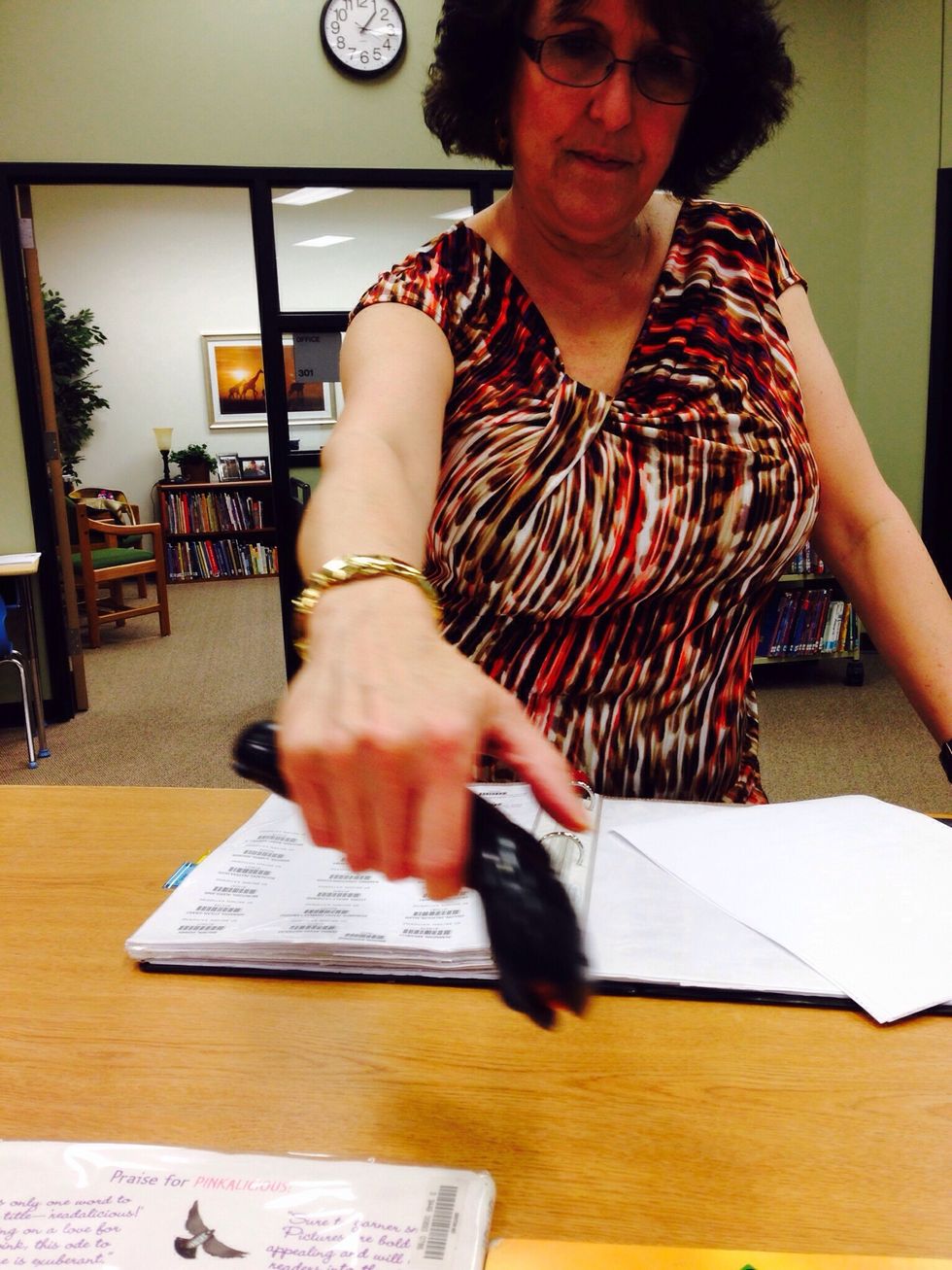 7. Finally you should go to the librarian's desk and let the librarian or assistant scan your account and your book.